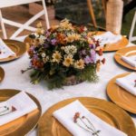 green and purple flower bouquet on table